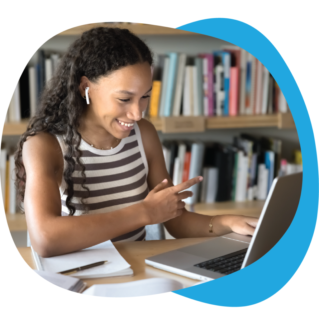 woman using a laptop in a library